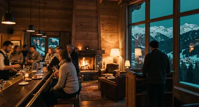 Bar d'hôtel de montagne à l'heure de l'après-ski, feu de cheminée, DJ de dos près de la baie vitrée